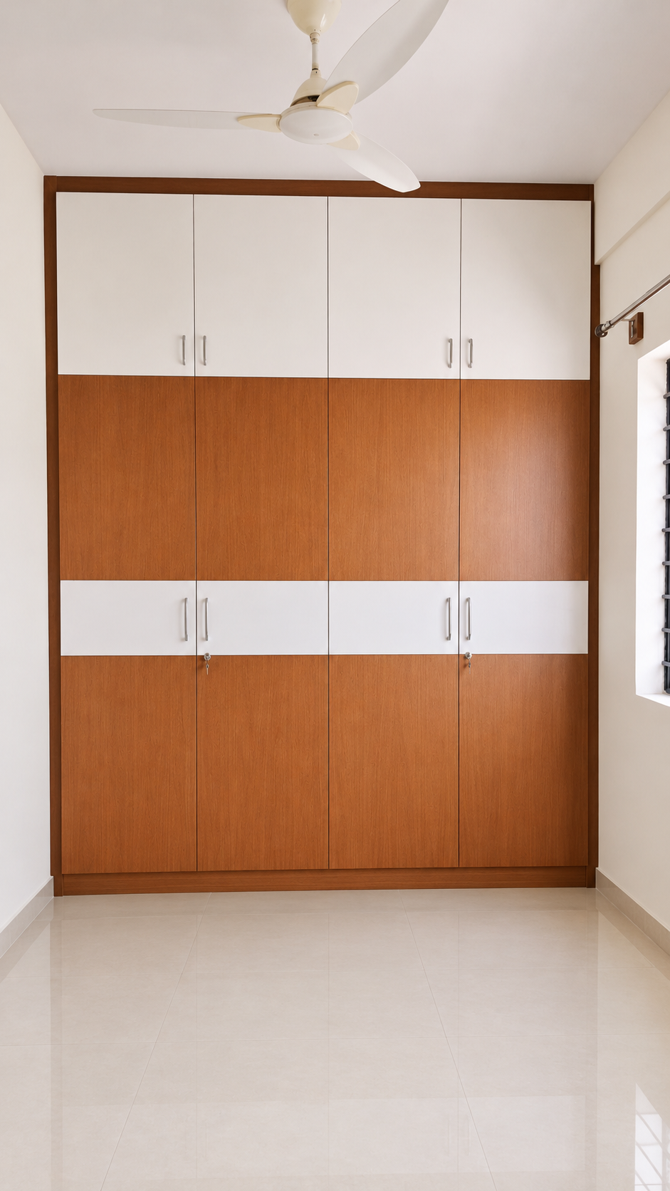 Kiran project kids’ room wardrobe with white cupboards and wood-toned doors