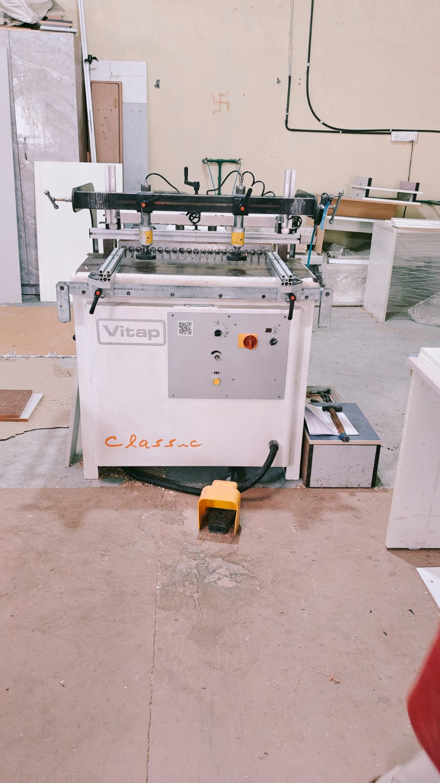 Multi-spindle boring machine used to drill hardware holes in furniture panels at the CMS Interiors factory.